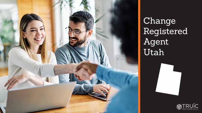 Couple meeting with registered agent, shaking hands.