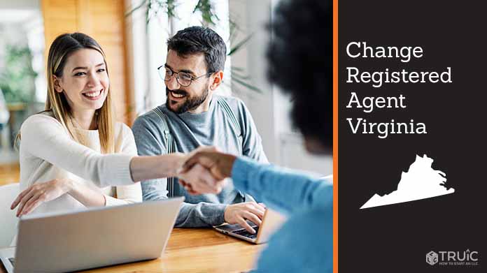 Couple meeting with registered agent, shaking hands.