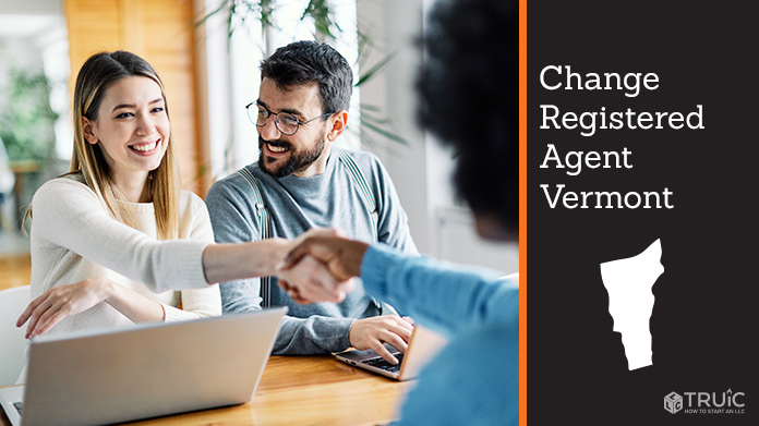 Couple meeting with registered agent, shaking hands.