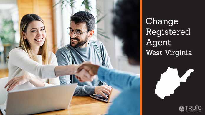 Couple meeting with registered agent, shaking hands.