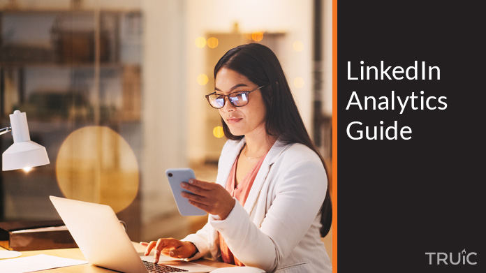 Woman looking at the LinkedIn analytics guide.
