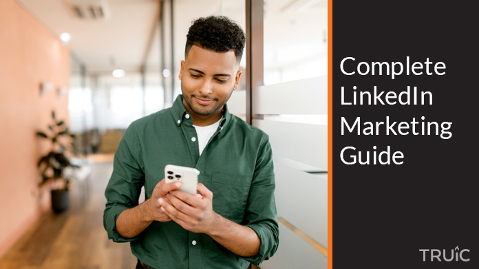 Man using a LinkedIn marketing guide.