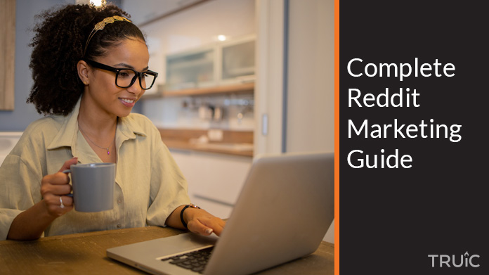 Woman looking at a Reddit marketing guide.