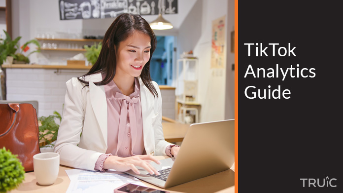 Woman looking at the TikTok analytics guide.